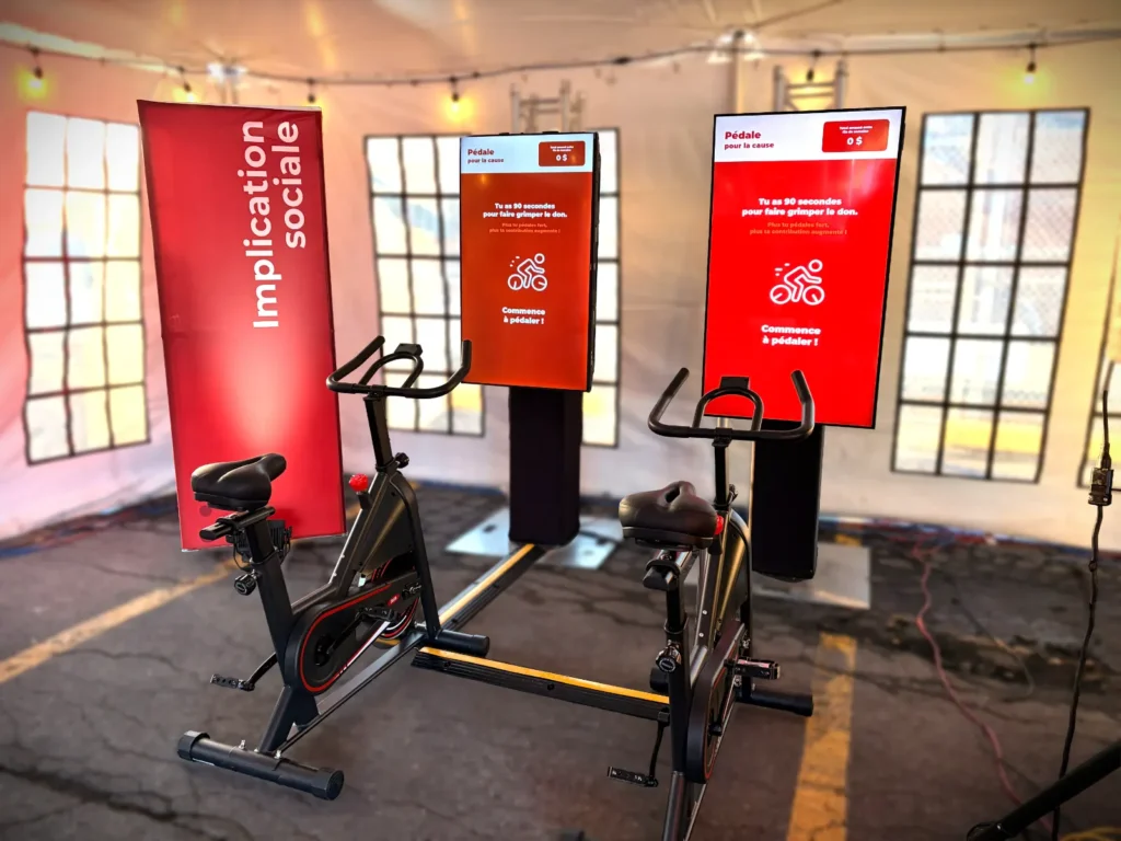 Two interactives bikes in front of monitors in a corporate event.